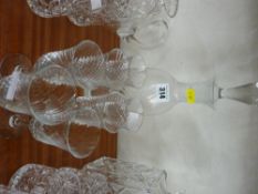 Bell shaped glass decanter and stopper with seven matching drinking glasses