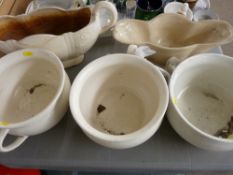 Three vintage chamber pots and two pottery planters
