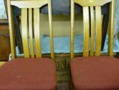 Set of four modern splatback dining chairs with upholstered seats