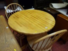 Circular modern breakfast table and pair of chairs