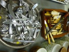 Plastic tray containing flatware and an electroplate tray with cutlery contents