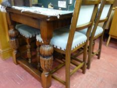 Refectory draw leaf table on pineapple supports and matching set of four studded back chairs