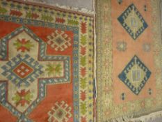 Two hand knotted Turkish Kars rugs, 190 x 134 cms and 198 x 137 cms approximately (located
