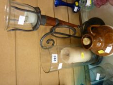Storm candle on stand, wrought iron candleholder (modern) and a pottery whisky flagon