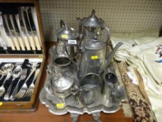 Electroplate two handled four footed tray with contents of electroplate and pewter teaware