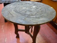African carved top circular occasional table