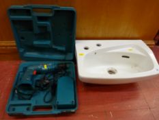 Small vanity sink and a Makita cordless drill E/T