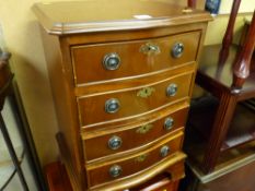 Neat reproduction mahogany serpentine front four drawer chest