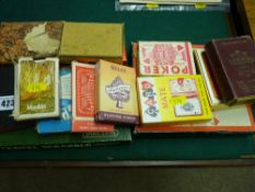 Collection of vintage playing cards, boxed travel Scrabble and Monopoly etc