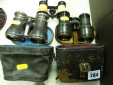 Two pairs of cased binoculars and a pair of uncased opera glasses