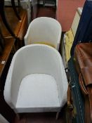 Two Lloyd loom style vintage armchairs