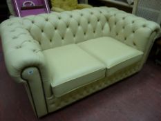Good cream leather two seater Chesterfield settee
