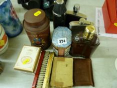 Four vintage hip flasks, two collectable storage tins etc