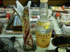Large Bells Whisky bottle and a similarly sized art glass vase