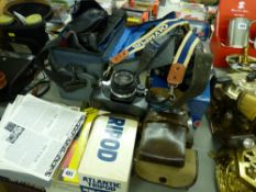 Collection of vintage cameras and associated equipment