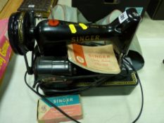 Small electrified Singer 99K sewing machine with accessories, handbook etc E/T