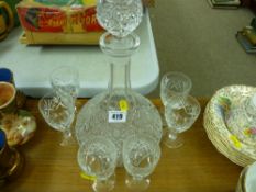Glass ship's decanter with stopper along with a set of six small drinking glassware