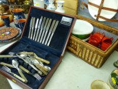 Cased quantity of loose cutlery and a wicker picnic basket and contents