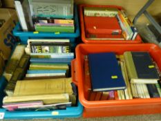 Four small plastic crates of books