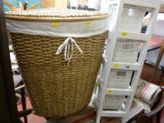 Wicker linen basket and a wicker and painted wood storage rack