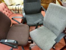 Two upholstered swivel office armchairs and one other