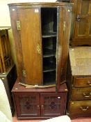 Antique oak two door bow fronted wall hanging corner cupboard and a modern mahogany effect two