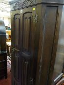 Priory style oak hall robe with linenfold front decoration