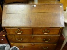 Circa 1830 oak fall front bureau having two short and two long lower drawers with pierced decoration