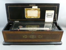 A GOOD SWISS CYLINDER MUSIC BOX playing twelve airs, the crossbanded rosewood case with boxwood