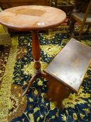 A VICTORIAN CIRCULAR TOPPED PINE TRIPOD TABLE and an oak slope top stool, 42 cms diameter the table,