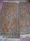 A PAIR OF SUPER KESHAN BELGIAN CARPETS with hand knotted fringes, both rust ground with repeating