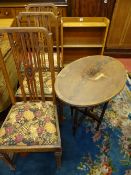 A VINTAGE OAK BOOKCASE, three high backed side chairs and a folding mahogany table, various