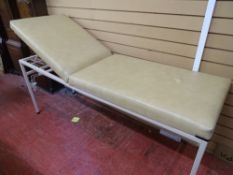 A MEDICAL/PHYSIO COUCH - fixed height with light coloured wipe down upholstery and adjustable head