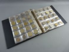 BRITISH & WORLD COINS - a pocket sleeved album containing a collection of British and World