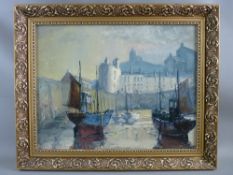 20th CENTURY BRITISH SCHOOL oil on board - Tenby Harbour with numerous beached boats, 34 x 44 cms