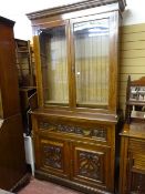 AN EDWARDIAN MAHOGANY SECRETAIRE BOOKCASE having a dentil moulded cornice over twin glazed doors