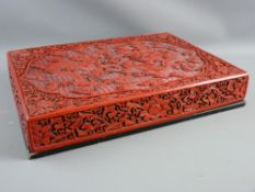 A CHINESE RED LACQUERWORK CARVED CINNABAR STYLE BOX, the lift-off lid with floral decorated sides