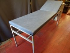 A MEDICAL/PHYSIO COUCH - fixed height having blue wipe down upholstery with adjustable head end,