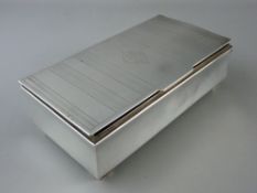 A GEORGE V SILVER CIGARETTE BOX, Birmingham 1935, 18 cms wide
