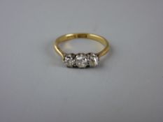 AN EIGHTEEN CARAT GOLD THREE STONE DIAMOND ENGAGEMENT RING, visual estimate of diamonds 0.1, 0.15,