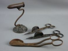 A CAST GOFFERING IRON STAND and three sets of antique candle snuffers, the stand stamped 'Kenrick'