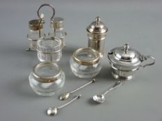 A THREE PIECE SILVER TOPPED GLASS CONDIMENT SET on a silver stand, 1.5 troy ozs, a pair of silver