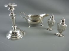 A GEORGE II SILVER SAUCE BOAT, two Victorian silver pepper pots and an Edward VII silver