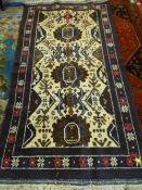 A ZEKANI AFGHANISTAN HAND KNOTTED RUG, blue, brown and cream ground with classical design central
