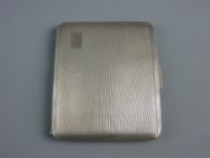 A SILVER CIGARETTE CASE, Birmingham 1944, 4.9 troy ozs, near mint condition with gilt interior