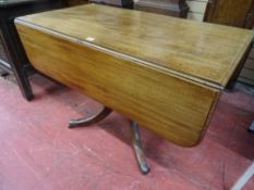 A GEORGIAN MAHOGANY TWIN FLAP SOFA TABLE with single end drawer on a turned column support and
