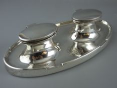 A SILVER OVAL SHAPED DOUBLE INKSTAND, Birmingham 1913 by A & J Zimmerman (one glass liner absent),