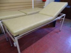 A MEDICAL/PHYSIO COUCH - fixed height with light coloured wipe down upholstery and adjustable head