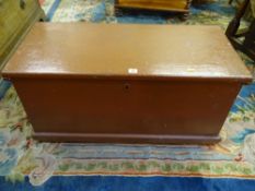 AN ANTIQUE PAINTED BLANKET CHEST with iron carry handles and lock, the interior with twin candle