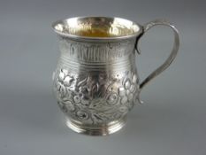 AN ORNATE GEORGIAN SILVER CHRISTENING MUG, 7 cms high, London hallmark, indistinct date letter and